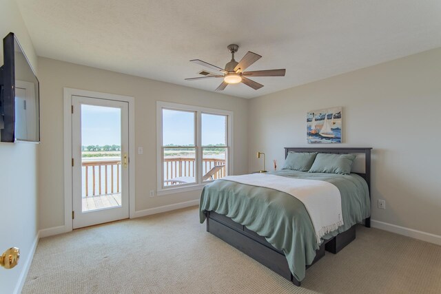164B Aquaticview Way, Savannah, TN 38372 - bedroom featuring access to outside, baseboards, light carpet, and a water view