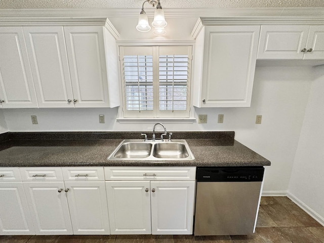 kitchen featuring white cabinetry, dark countertops, a sink, and dishwasher