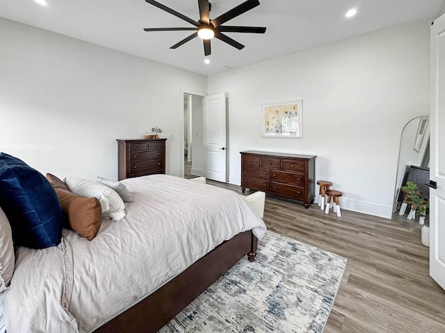 bedroom featuring recessed lighting, baseboards, and wood finished floors