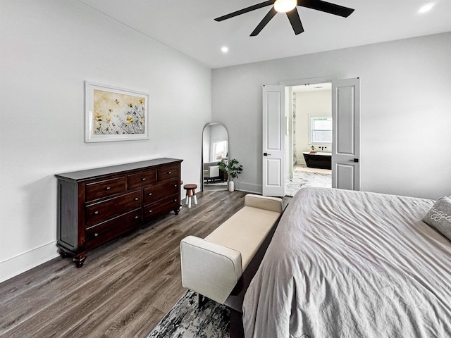 bedroom with ceiling fan, ensuite bath, dark wood finished floors, baseboards, and recessed lighting