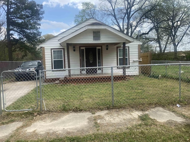 bungalow with a gate, a fenced front yard, a porch, and a front lawn