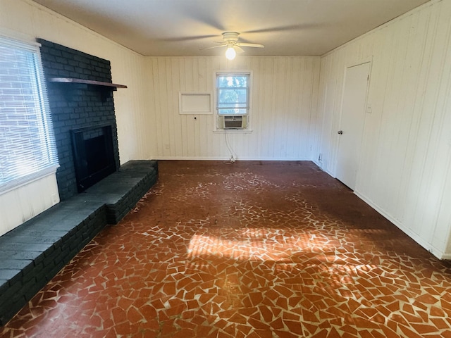 unfurnished living room with a brick fireplace, ceiling fan, and cooling unit