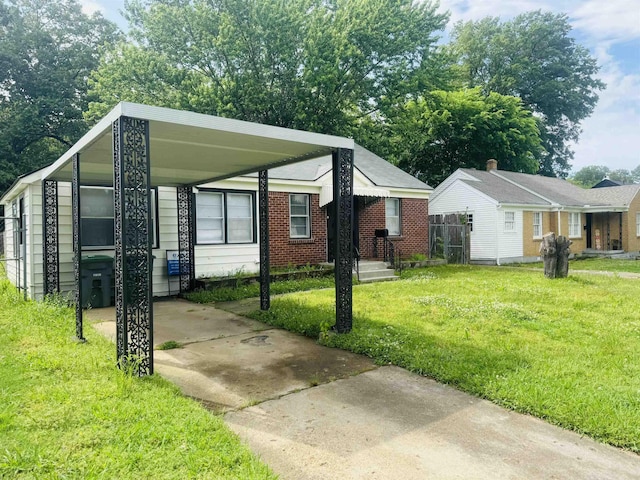 view of side of property with a lawn and concrete driveway