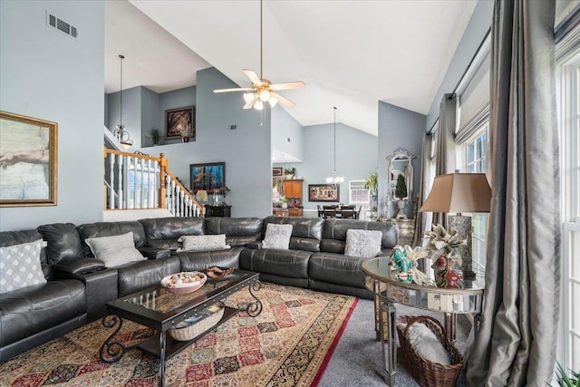 235 Fairoaks Dr, Oakland, TN 38060 - carpeted living room with stairway, high vaulted ceiling, ceiling fan with notable chandelier, and visible vents