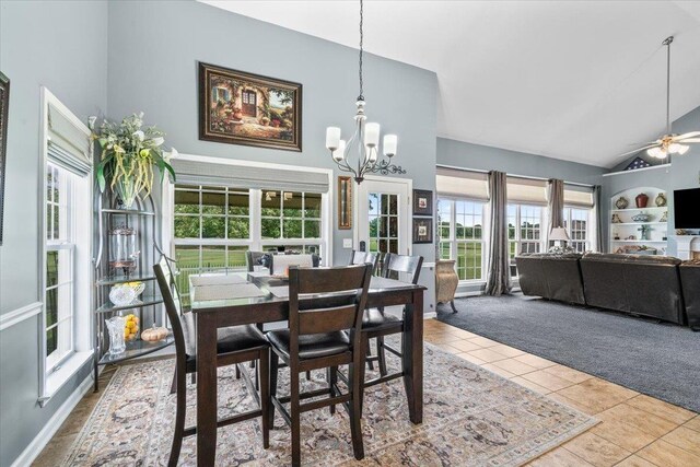 235 Fairoaks Dr, Oakland, TN 38060 - carpeted dining room featuring high vaulted ceiling, tile patterned floors, and a wealth of natural light
