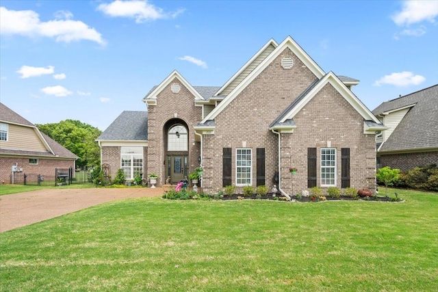 235 Fairoaks Dr, Oakland, TN 38060 - view of front facade with a front lawn and brick siding