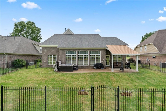 235 Fairoaks Dr, Oakland, TN 38060 - back of property with a yard, brick siding, a fenced backyard, and a patio area