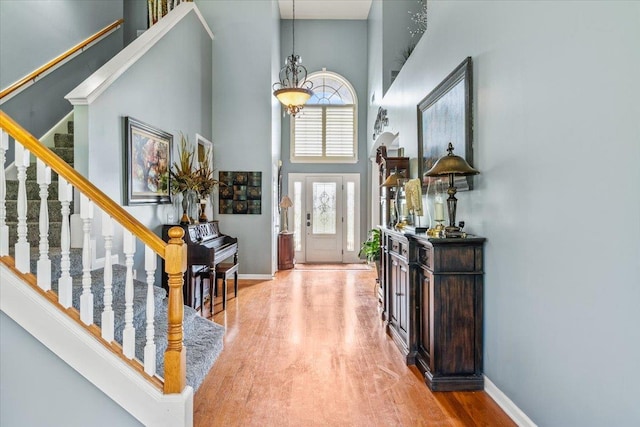 235 Fairoaks Dr, Oakland, TN 38060 - foyer with stairs, baseboards, wood finished floors, and a towering ceiling