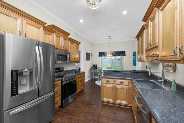 kitchen featuring a peninsula, dark countertops, appliances with stainless steel finishes, and a sink
