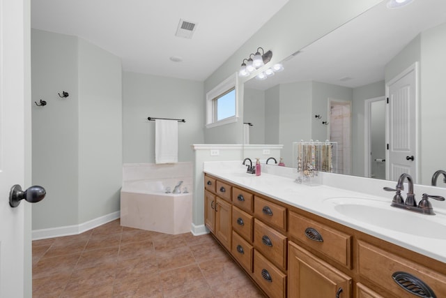 bathroom featuring a sink, baseboards, a bath, and visible vents