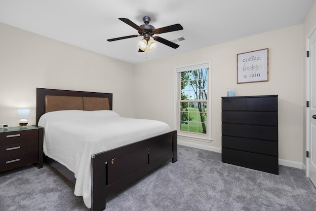carpeted bedroom featuring baseboards, ceiling fan, and visible vents