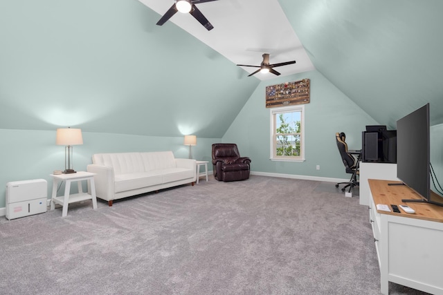 carpeted home office featuring baseboards, a ceiling fan, and lofted ceiling