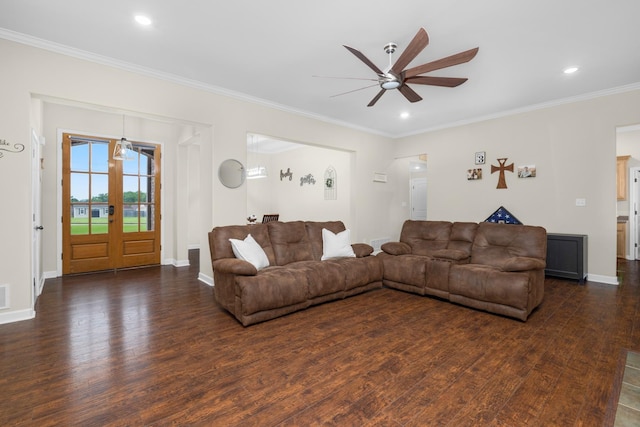 living room with baseboards, a ceiling fan, dark wood-style flooring, and ornamental molding