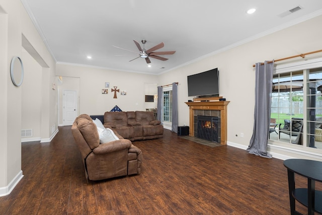 living area featuring ceiling fan, visible vents, and wood finished floors