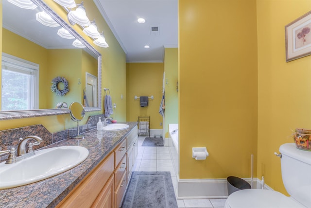bathroom featuring a sink, tile patterned floors, a garden tub, and toilet