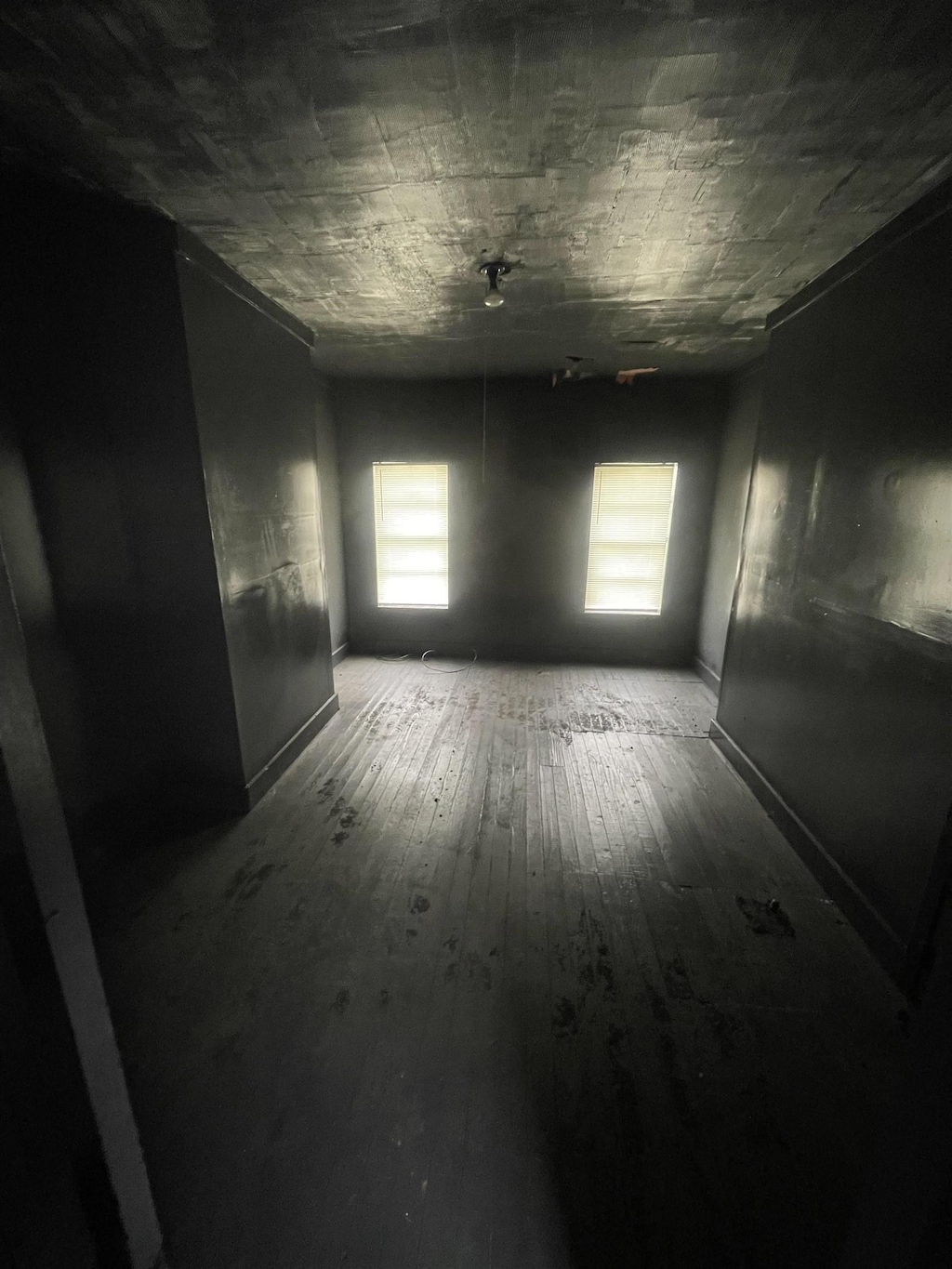 unfurnished room with wood-type flooring