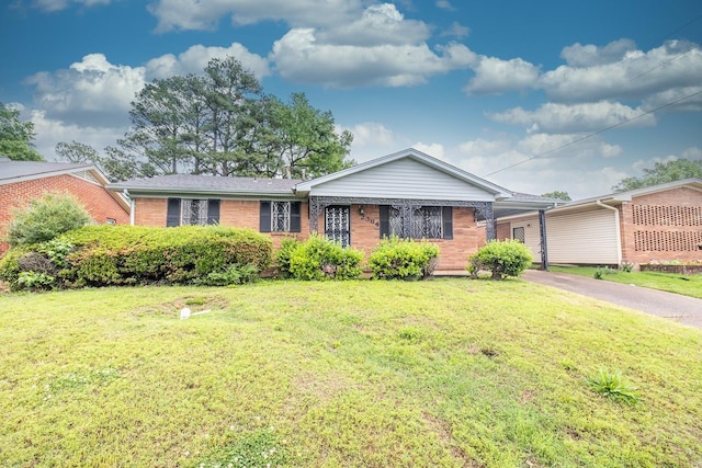 2364 Rozelle St, Memphis, TN 38114 - single story home with brick siding, an attached carport, driveway, and a front yard