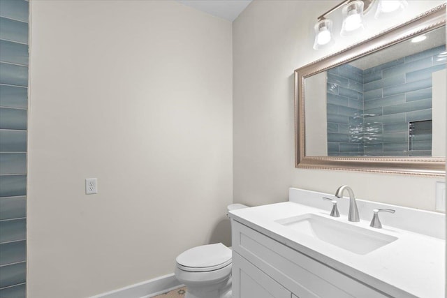 1682 Lawrence Ave, Memphis, TN 38112 - bathroom with vanity, baseboards, and toilet