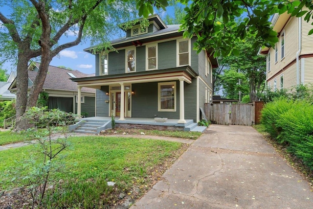 1682 Lawrence Ave, Memphis, TN 38112 - traditional style home with a porch, fence, driveway, and a gate