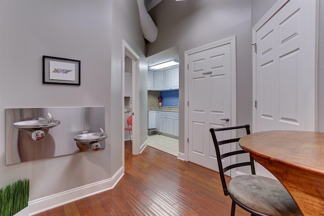 interior space with baseboards and hardwood / wood-style flooring