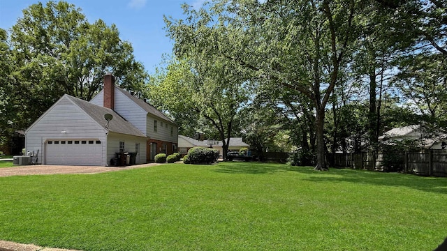 view of home's exterior with fence, central AC, a garage, a lawn, and dirt driveway
