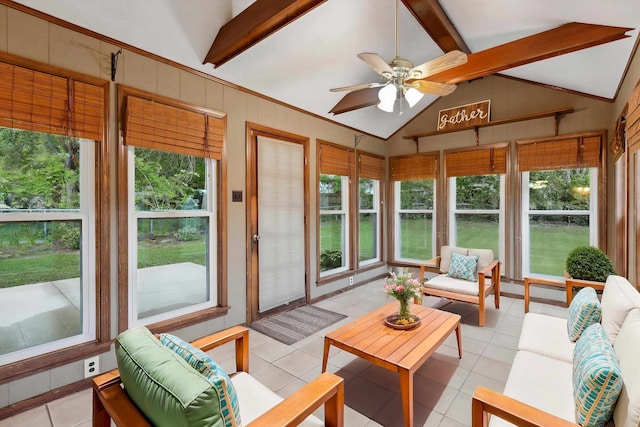 sunroom with tile patterned flooring and vaulted ceiling with beams