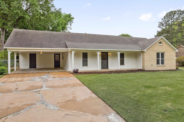 ranch-style home featuring concrete driveway, a porch, roof with shingles, and a front lawn