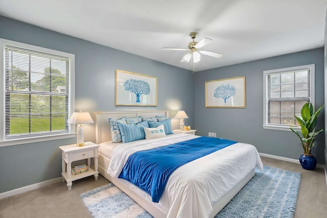 bedroom featuring carpet flooring, baseboards, and ceiling fan