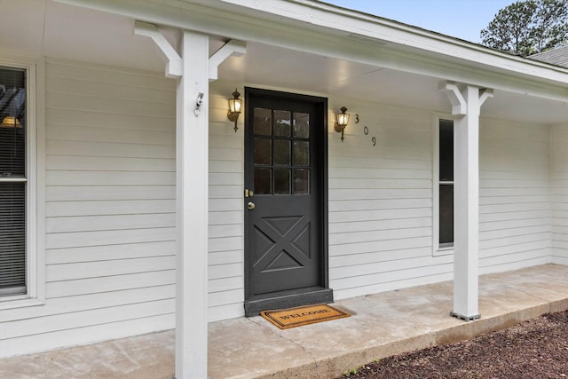 doorway to property featuring a porch