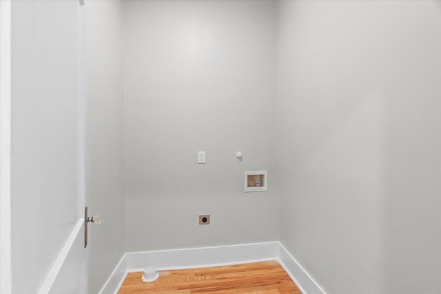 laundry area with baseboards, laundry area, electric dryer hookup, and hookup for a washing machine