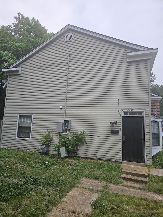 view of property exterior with entry steps
