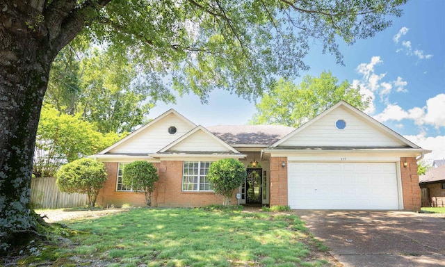 ranch-style house featuring a garage, brick siding, fence, a front lawn, and concrete driveway