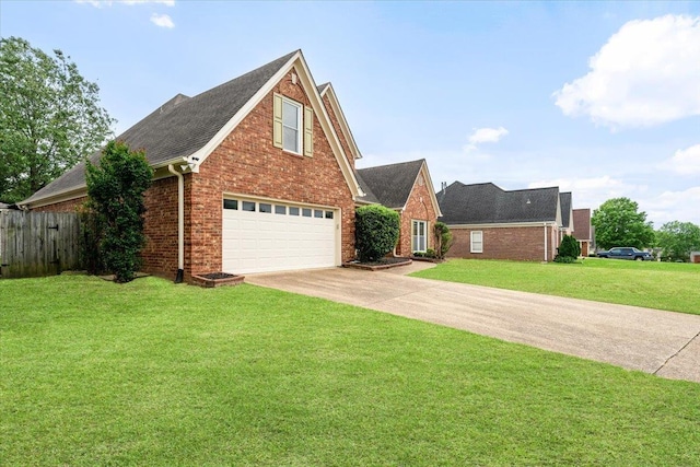 view of front of home with a garage, fence, a front yard, brick siding, and driveway
