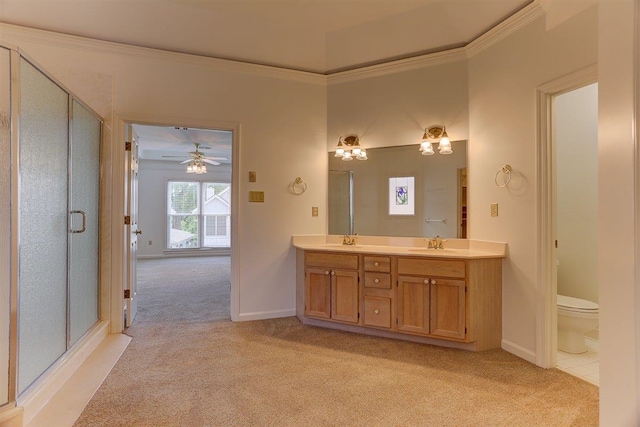 full bathroom with crown molding, a sink, a stall shower, and double vanity