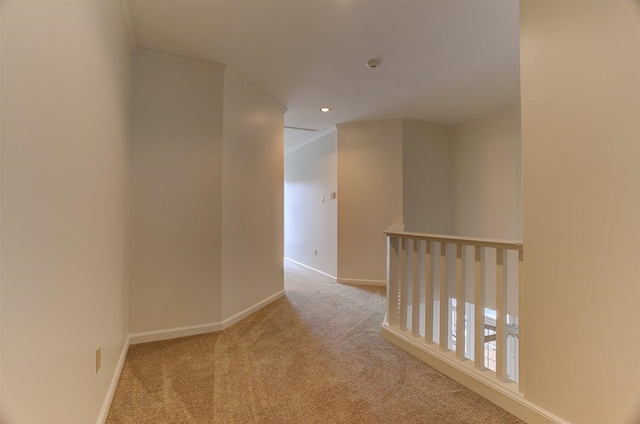 corridor with crown molding, recessed lighting, baseboards, and carpet floors