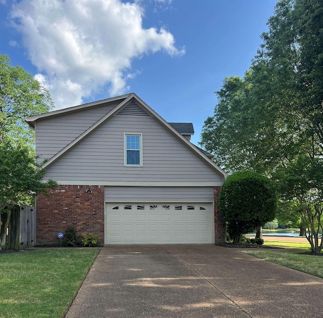 view of property exterior with brick siding, driveway, and a garage