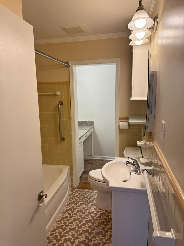 full bathroom with vanity, toilet, crown molding, tile patterned floors, and bathtub / shower combination