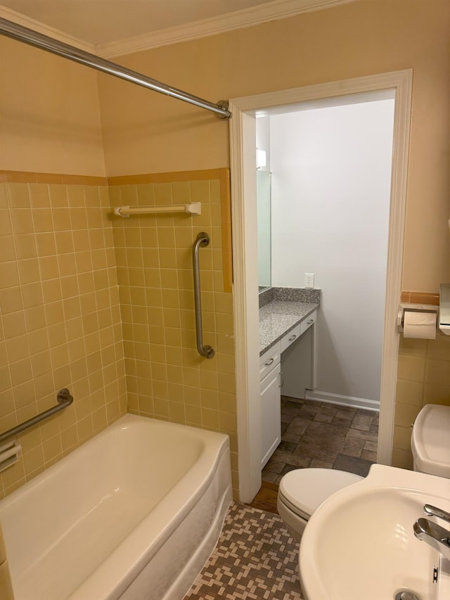 bathroom with toilet, ornamental molding, bathtub / shower combination, and vanity