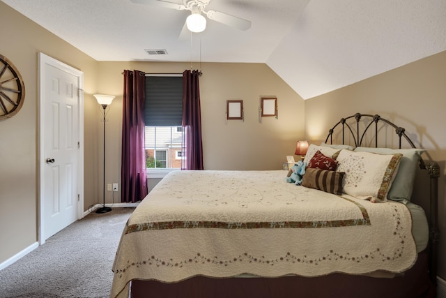 carpeted bedroom featuring vaulted ceiling, ceiling fan, baseboards, and visible vents