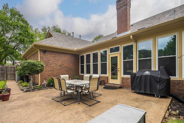 view of patio / terrace with fence, area for grilling, and outdoor dining space