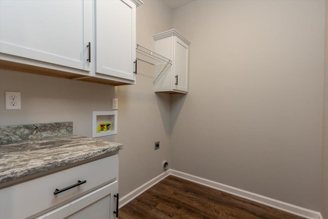 clothes washing area featuring cabinet space, dark wood finished floors, electric dryer hookup, washer hookup, and baseboards