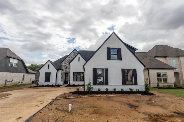 view of front of home with brick siding