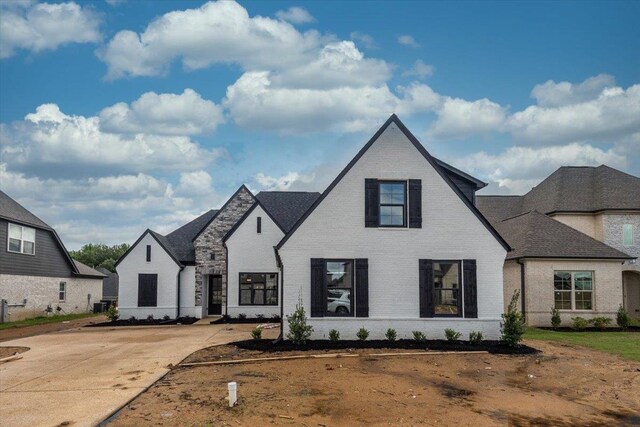view of front of home featuring brick siding