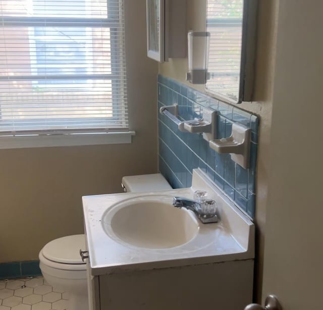 2997 Atmore St, Memphis, TN 38118 - half bathroom featuring toilet, a wealth of natural light, tile patterned floors, and vanity