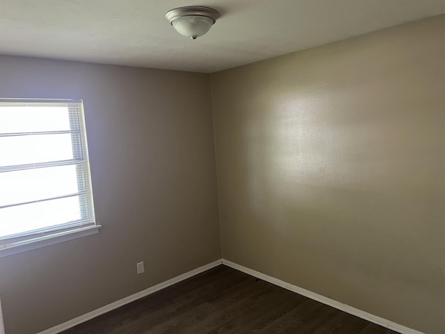 2997 Atmore St, Memphis, TN 38118 - unfurnished room featuring baseboards and dark wood-type flooring