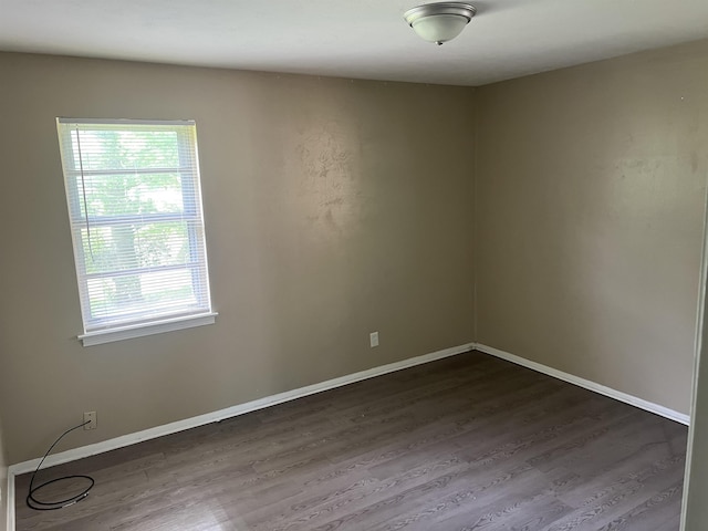 2997 Atmore St, Memphis, TN 38118 - spare room featuring baseboards, a healthy amount of sunlight, and dark wood-style floors