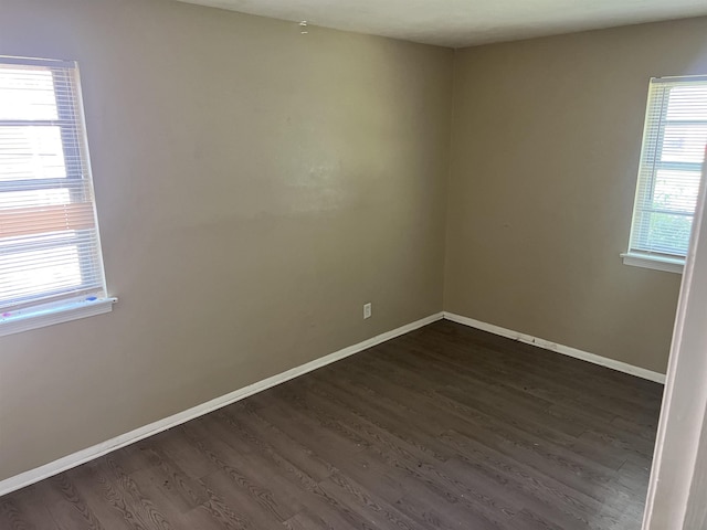 2997 Atmore St, Memphis, TN 38118 - spare room with baseboards and dark wood-type flooring