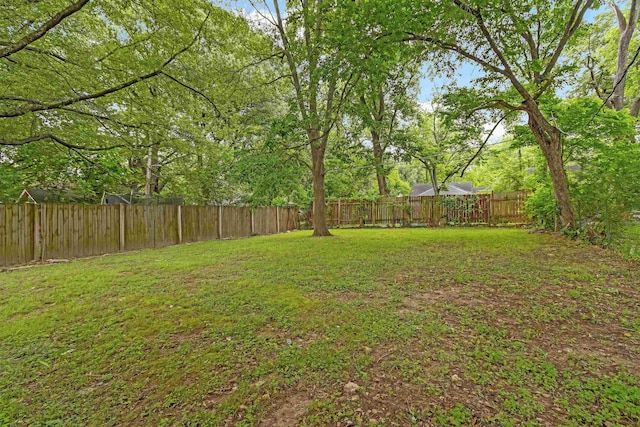 view of yard with a fenced backyard
