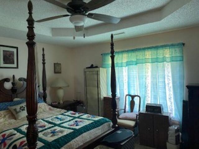 283 Brierhedge Rd, Covington, TN 38019 - bedroom with multiple windows and a textured ceiling