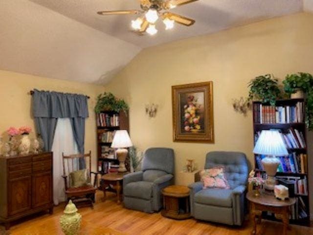 283 Brierhedge Rd, Covington, TN 38019 - living area with a ceiling fan, light wood-type flooring, and vaulted ceiling
